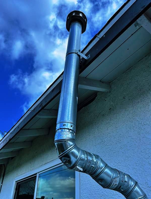 Water heater flue installation on a Pomona area home