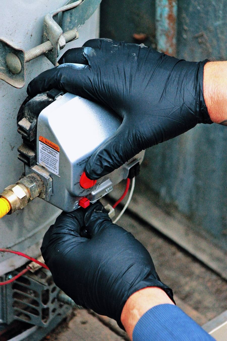 Technician servicing water heater in Pomona, CA